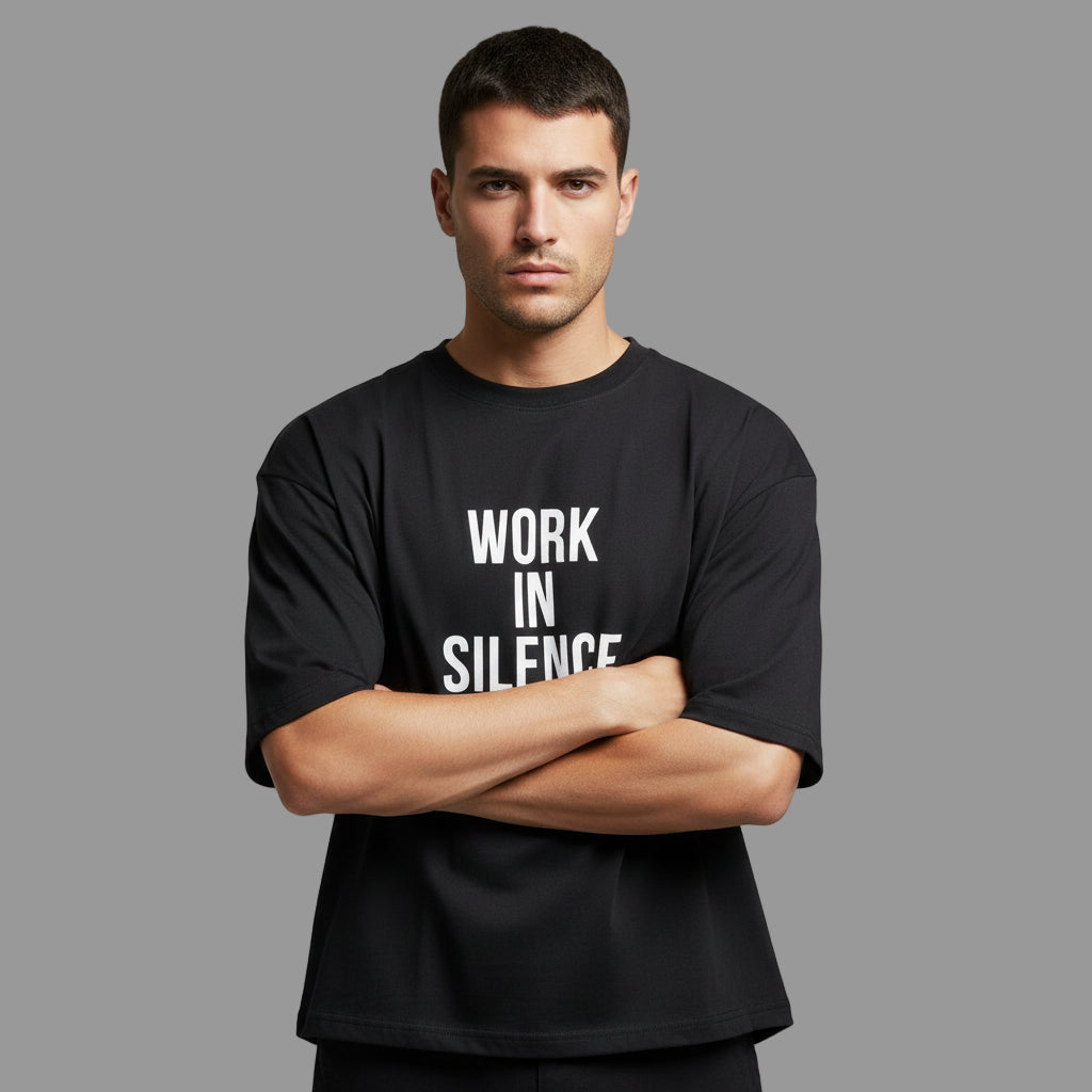 Black t-shirt with 'Work in Silence' text on a plain background
